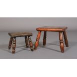 AN EARLY 19TH CENTURY ELM FOOTSTOOL, the chamfered rectangular top on turned legs, 21cm wide x