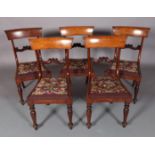 A SET OF FIVE EARLY VICTORIAN MAHOGANY DINING CHAIRS with concave cresting rail and C-scroll