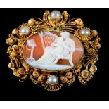 AN EARLY 19TH CENTURY SHELL CAMEO AND SEED PEARL BROOCH, in 15ct gold, the oval portrait of Cupid