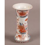 A JAPANESE IMARI VASE c.1700 of waisted baluster form with floral decoration, 17cm high