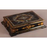 A VICTORIAN BLACK LACQUERED PAPIER MÂCHÉ AND MOTHER OF PEARL INLAID WRITING BOX, gilt with borders