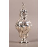 A LATE VICTORIAN SILVER SUGAR CASTOR, London 1896, George Fox, of writhen baluster form, the domed