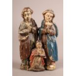 THREE 19TH CENTURY POLYCHROME DECORATED NATIVITY FIGURES, all with clasped hands, 15.5cm high and