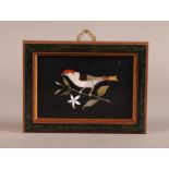 A VICTORIAN ASHFORD AND PIETRA DURA HARDSTONE PANEL decorated with a goldfinch on a branch, 10cm