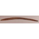 AN AUSTRALIAN ABORIGINAL BOOMERANG with incised linear decoration, c.1900, 73cm long