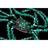 AN EARLY 20TH CENTURY CHRYSOPHRASE NECKLACE the four graduated rows of circular beads fastened