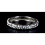 A DIAMOND ETERNITY RING, the brilliant cut stones grain set in line in white metal (tests as 14ct