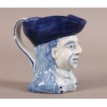 A QUIMPER BLUE AND WHITE FAIENCE HEAD AND SHOULDERS TOBY JUG, painted AP monogram to underside, 11cm