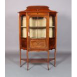 AN EDWARD VII MAHOGANY DISPLAY CABINET inlaid in ebony and boxwood, having a shaped and raised