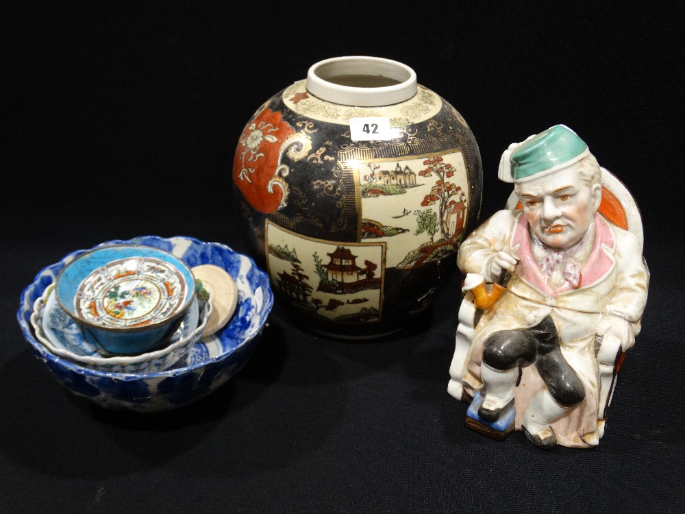 A 19th Century Staffordshire China Tobacco Pot & Cover In The Form Of A Pipe Smoker Together With