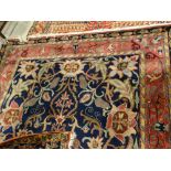 A Blue & Red Ground Floral Patterned Carpet With Tassel Borders, 106 X 74"