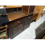 A 20th Century Dark Oak Linen Fold Sideboard