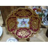 A 20th Century Dished Display Plate With Centre Floral Spray & Gilt & Crimson Border, Crossed Blue