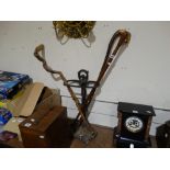 Three Vintage Wooden Walking Sticks, Together With A Cast Metal Stick Stand