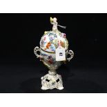 A Dresden China Two Handled Pot & Cover With Cherub Knop & Floral Bocage, 10" High