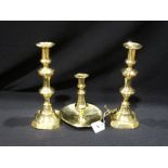 A Pair Of Antique Brass Candle Holders, Together With A Brass Chamber Stick