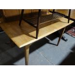 A Mid Century Extending Dining Table On Tapered Supports