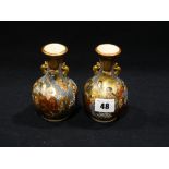 A Pair Of Japanese Satsuma Pottery Miniature Narrow Necked Vases, Decorated With Figures, 5" High