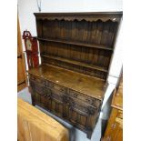 A Reproduction Oak Elizabethan Style Dresser, Having A Two Shelf Rack & Base Of Cupboards & Drawers