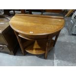 An Early 20th Century Polished Oak Half Moon Two Tier Hall Table