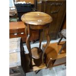 An Edwardian Circular Topped Two Tier Jardiniere Stand