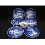 Ten Circular Royal Copenhagen Xmas Plates, Together With Four Small Dishes
