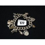 A Silver Bracelet & Charms With Heart Shaped Padlock