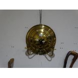 A Circular Brass Two Branch Wall Sconce