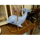 A Mid Century Raleigh Hard Plastic Rocking Dolphin On Tubular Metal Frame