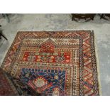 A Blue & Red Ground Patterned Carpet, 98 X 70"