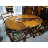 A Mid 20th Century Oak Gate Leg Dining Table, Together With A Set Of Four Ladder Backed Chairs