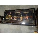 A 20th Century Oriental Lacquerwork Coffee Table With Embossed Figures In A Garden Setting