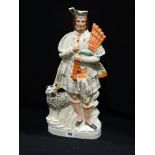 A Staffordshire Pottery Portrait Figure Of A Scottish Musician