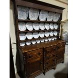 An Antique Oak Anglesey Breakfront Dresser, The Base Having An Arrangement Of Cupboards & Drawers,