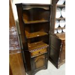 A 20th Century Polished Oak Standing Corner Cabinet