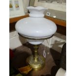 A Circular Based Brass Column Oil Lamp With Milk Glass Reservoir & Shade