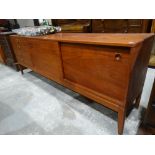 A Mid Century Rosewood Finish Dining Room Sideboard With Bank Of Four Drawers & Two Sliding Doors,