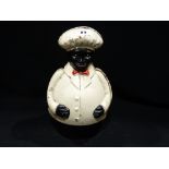 A Cast Metal Money Box In The Form Of A Portly Gentleman