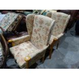 A Pair Of Floral Upholstered Wing Backed Easy Chairs