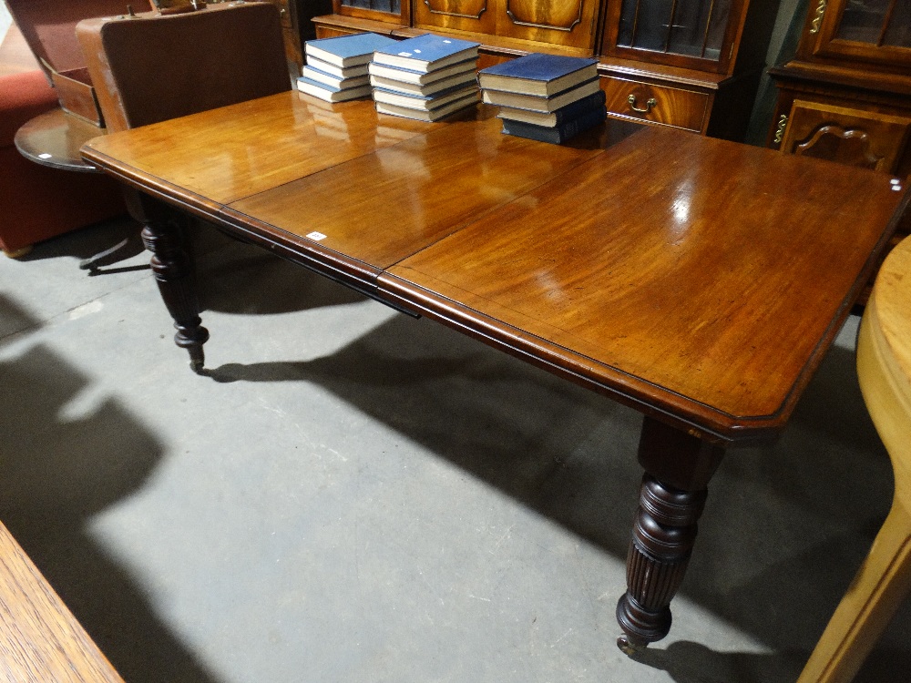 A Late Victorian Mahogany Extending Dining Table With ...