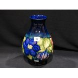 A Circular Based William Moorcroft Clematis Pattern Bulbous Vase, Signed, 12" High