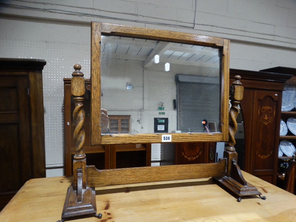 An Early 20th Century Polished Oak Swing Mirror