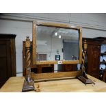 An Early 20th Century Polished Oak Swing Mirror