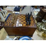 An Antique Oak Games Box With Checkerboard Top & Quantity Of Wooden Chess Pieces