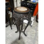 An Early 20th Century Oriental Hardwood Jardiniere Stand With Inset Pink Marble Top