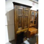 An Oak Four Door Standing Corner Cupboard
