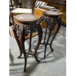 A Pair Of Early 20th Century Oriental Hardwood Jardiniere Stands With Inset Pink Marble Tops