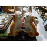 A Pair Of Staffordshire Pottery Seated Dogs