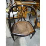 An Early 20th Century Cane Seated Empire Style Tub Chair