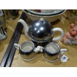An Early 20th Century White Pottery & Chrome Covered Three Piece Tea Service